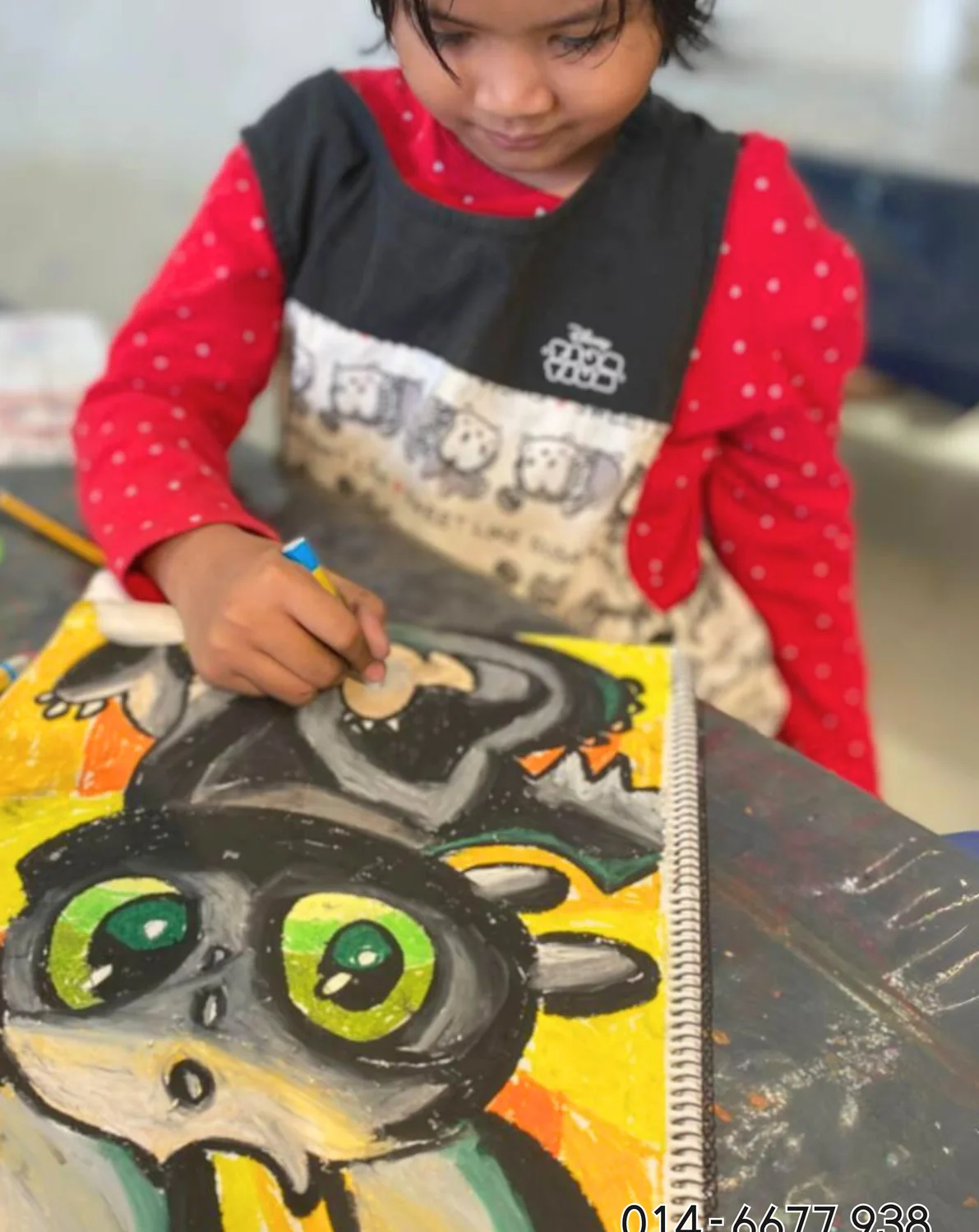 Child painting an expressive animal artwork in a hands-on Rycca class