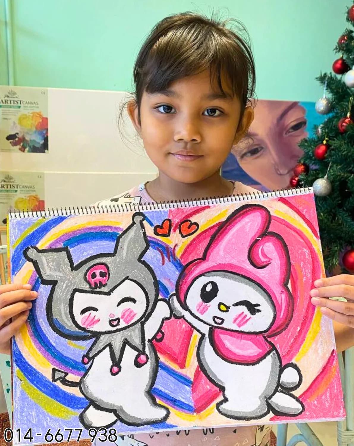 Girl holding cute bunny character painting from Rycca kids art class