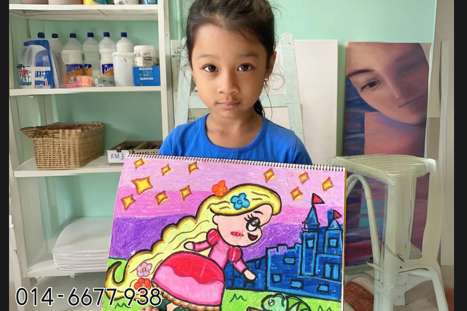 Girl presenting storybook city painting from Rycca kids class
