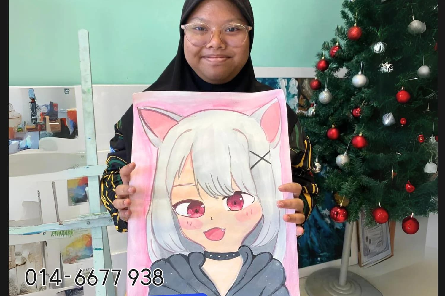 Teen student holding anime portrait artwork from Rycca drawing class